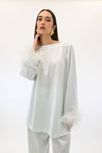 Twinset blusa con piume color acqua